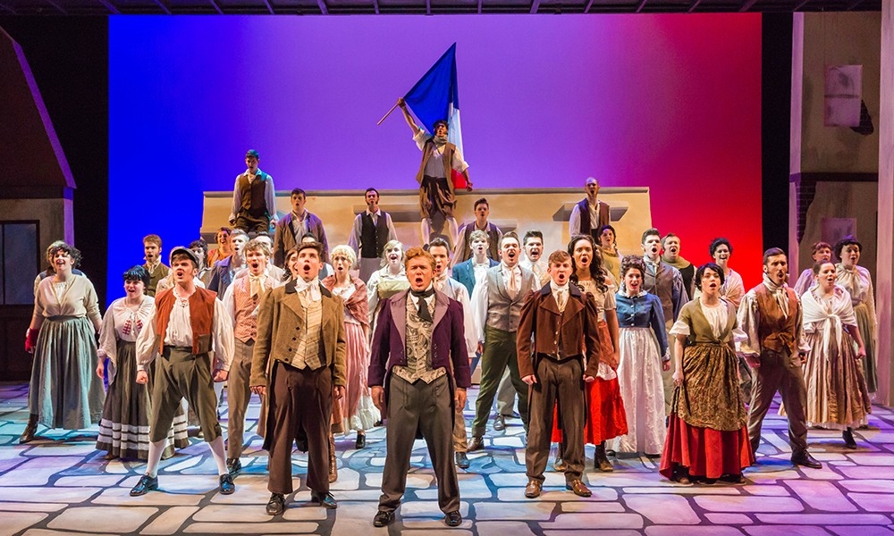 Students singing on stage