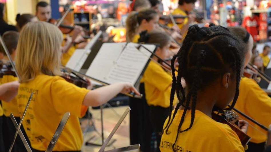 Children playing string instruments