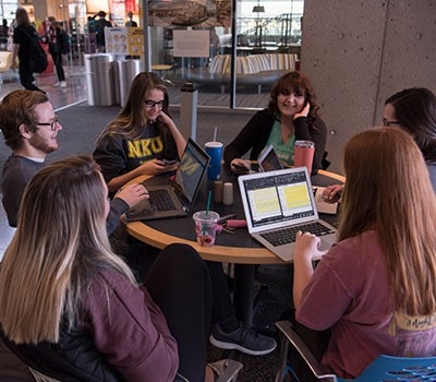 Group of students around round table