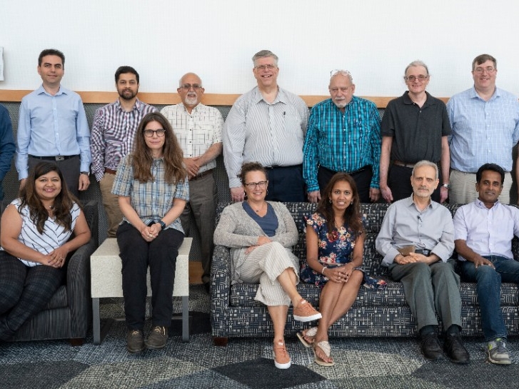 Physics, Geology, and Engineering Technology faculty pose for a group photo.
