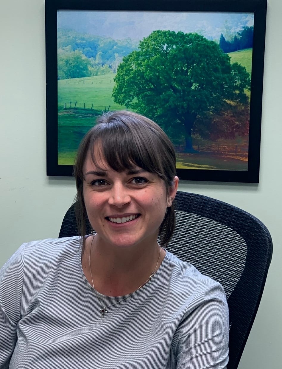 Abby Fritsch sitting at desk 