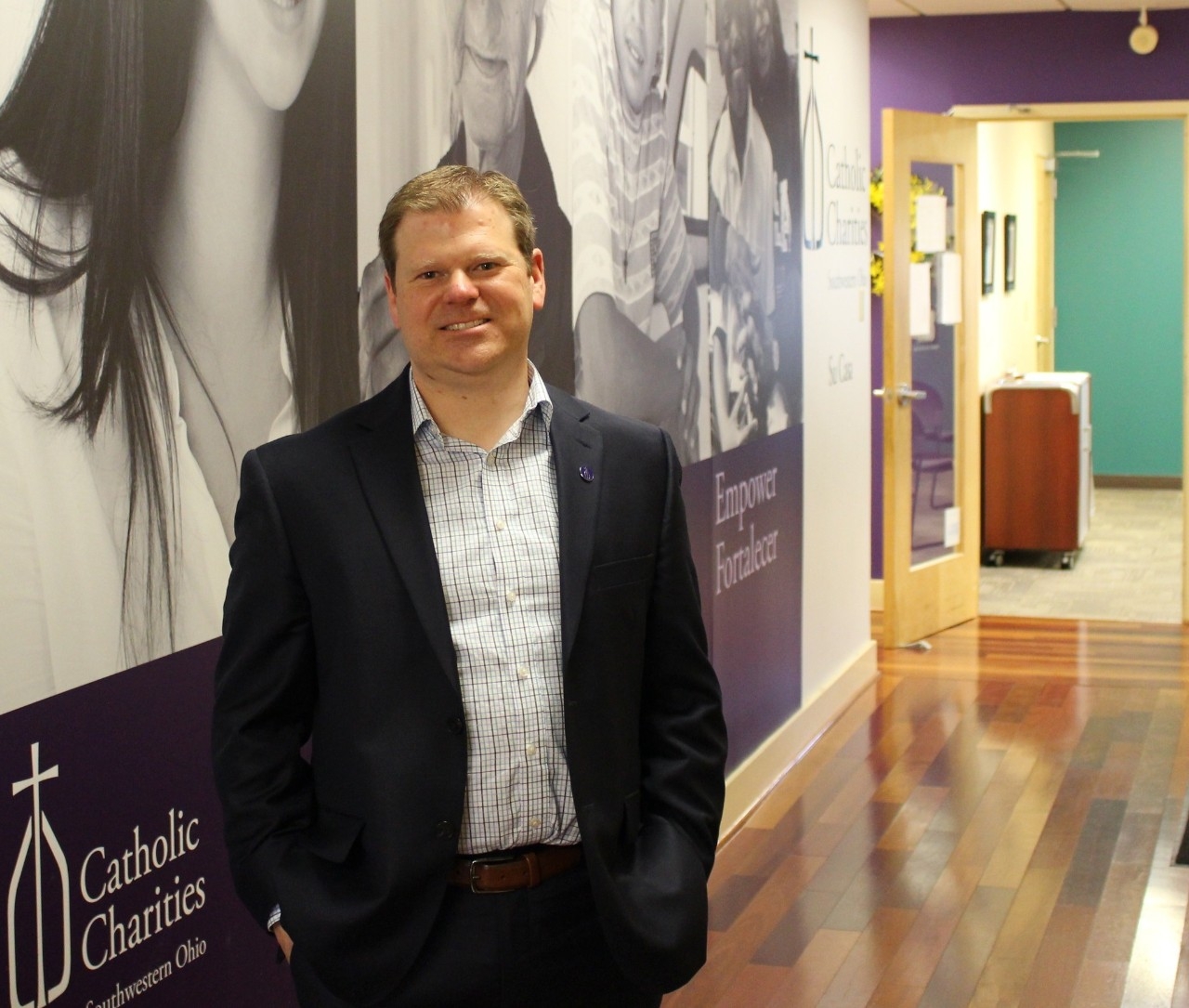 tony Stieritz inside hallway of Catholic Charities office