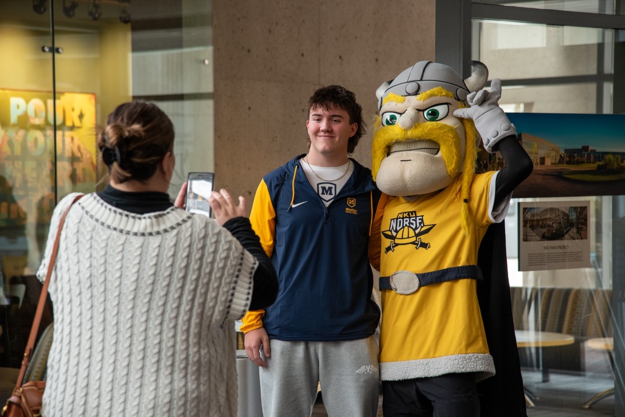 Student taking a selfie on Instagram